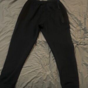 Men’s NIKE DRI-FIT Stylish Black ON Black Joggers with Side Stripe.